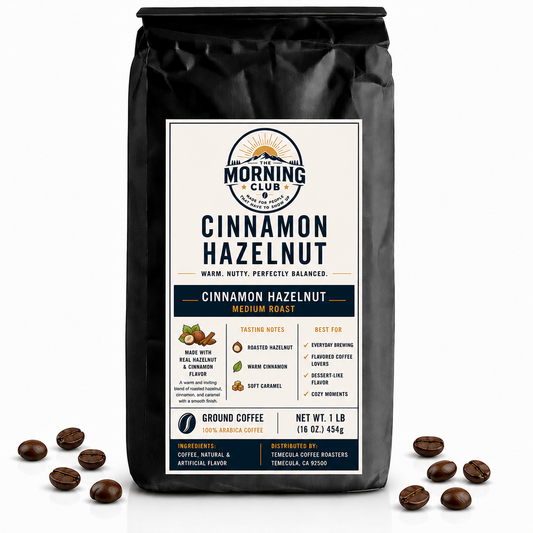 1 lb bag of Morning Club Cinnamon Hazelnut flavored ground coffee on a white background with coffee beans scattered around the base