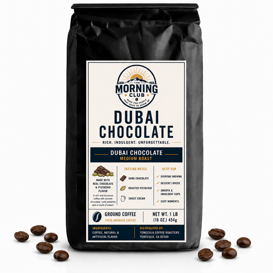 1 lb bag of Morning Club Dubai Chocolate flavored ground coffee on a white background with coffee beans scattered around the base