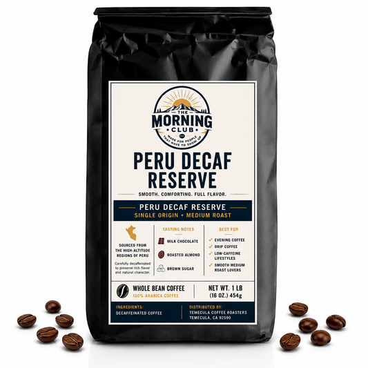 A 1 lb bag of The Morning Club Peru Decaf Reserve single-origin decaf coffee displayed on a white background with scattered coffee beans.